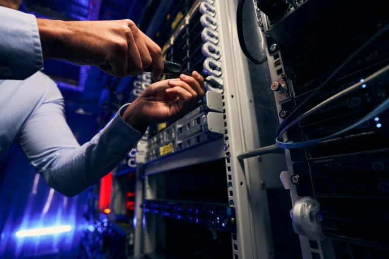 Experienced IT technician installing new network equipment